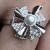 Toptan Gümüş Renk İnci Ve Kanat Model Zirkon Taşlı Çelik Ayarlanabilir Ucu Dönen Stres Çelik Yüzük - 3097 2 a3ca19ac24954a3ca0f3a32f7008f7ca-toptan taki