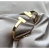 Toptan Altın Renk Tiffany Model T Uçlu Desenli Kelepçe Çelik Bileklik - 2116 2 e639d6c81776409da4741503555db490-toptan taki